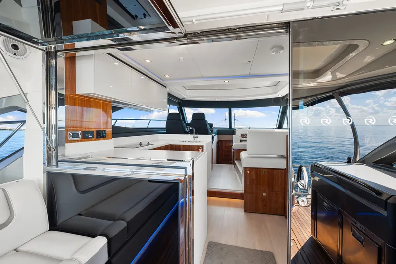 Slide: The Image of Luxurious interior of 2024 Riviera 4600 Sport Yacht Platinum Edition with ocean view. - 41