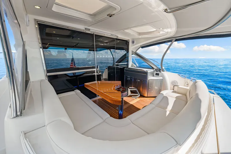 Slide: The Image of Luxurious 2024 Riviera 4600 Sport Yacht Platinum Edition interior with ocean view. - 26