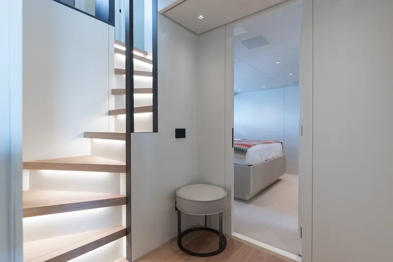 Slide: The Image of Modern interior of 2024 Sanlorenzo SL90A yacht with illuminated staircase and bedroom. - 38