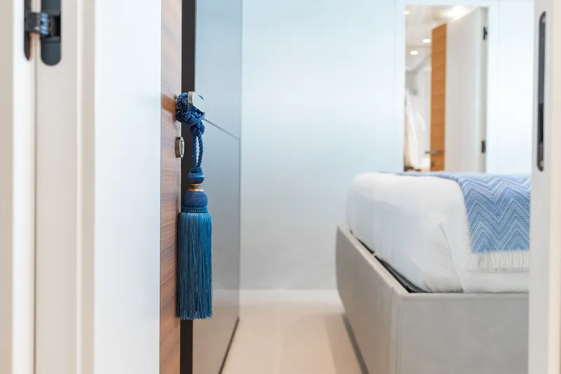 Slide: The Image of Luxurious bedroom interior on 2024 Sanlorenzo SL90A yacht, featuring elegant blue tassel decor. - 45