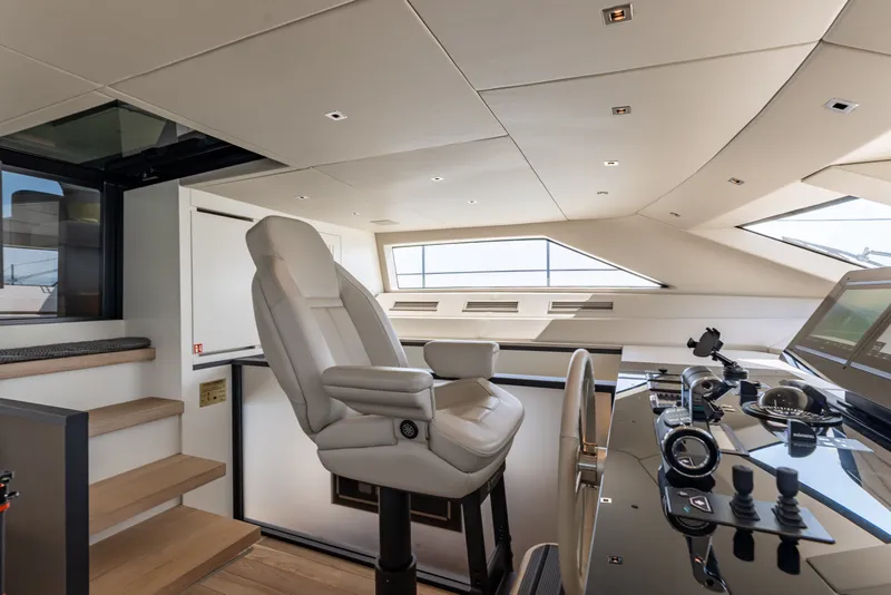 Slide: The Image of Luxurious helm station of 2024 Sanlorenzo SL90A yacht with modern controls and seating. - 67