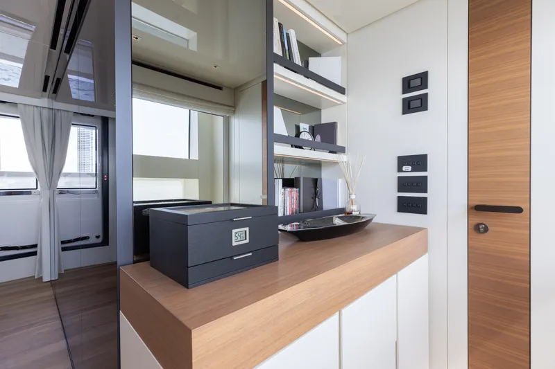 Slide: The Image of Luxurious interior of 2024 Sanlorenzo SL90A yacht with modern decor and shelving. - 62