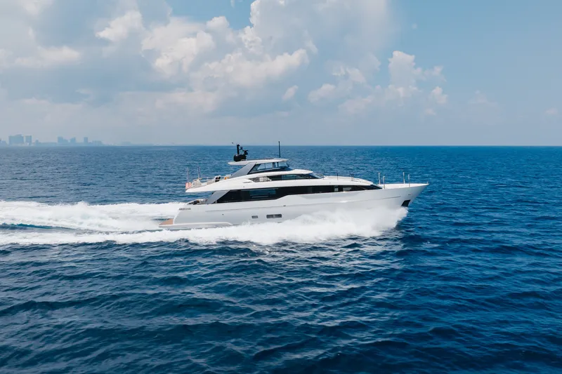 Slide: The Image of 2024 Sanlorenzo SL90A yacht cruising on open sea under a cloudy sky. - 17