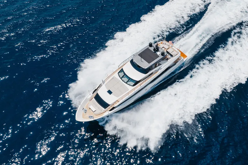 Slide: The Image of 2024 Sanlorenzo SL90A yacht cruising on open blue sea, aerial view. - 14