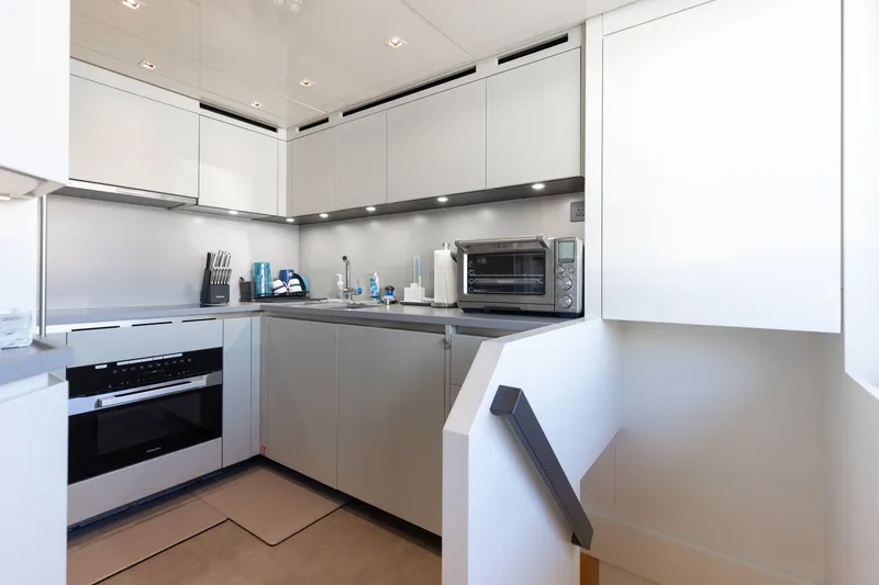 Slide: The Image of Modern kitchen interior on 2024 Sanlorenzo SL90A yacht, featuring sleek cabinetry and appliances. - 37