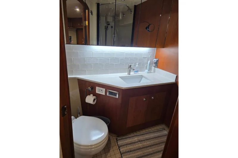 Slide: The Image of Bathroom interior of 2001 Cruisers Yachts 4450 Express Motoryacht with modern fixtures. - 15