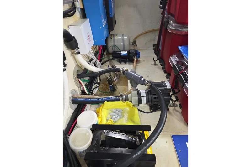Slide: The Image of Engine room of 2001 Cruisers Yachts 4450 Express Motoryacht with hoses and equipment. - 23