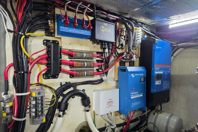 Slide: The Image of Electrical system of a 2001 Cruisers Yachts 4450 Express Motoryacht, featuring battery chargers and wiring. - 22