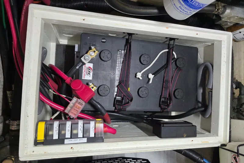 Slide: The Image of Battery compartment of a 2001 Cruisers Yachts 4450 Express Motoryacht with wiring and fuses. - 25