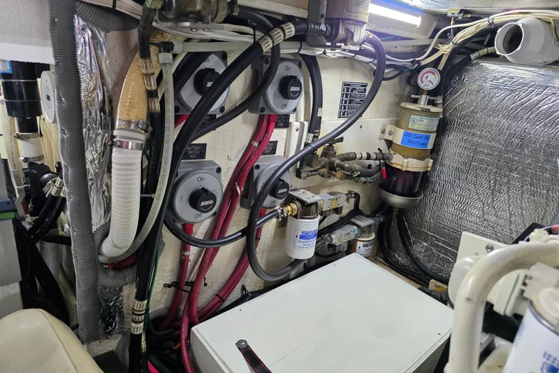 Slide: The Image of Engine room of 2001 Cruisers Yachts 4450 Express Motoryacht with wiring and fuel filters. - 24