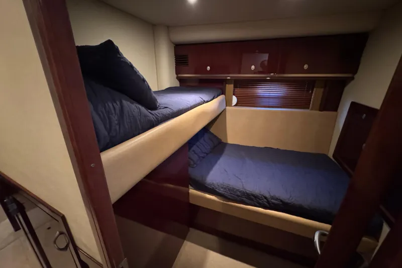 Slide: The Image of 2007 Sea Ray 58 Sedan Bridge cabin with bunk beds and wooden cabinetry. - 40