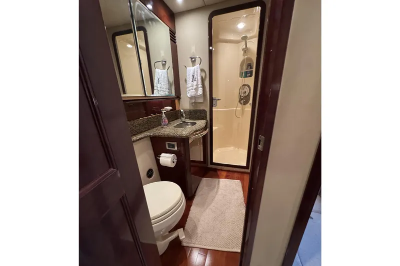 Slide: The Image of Luxurious bathroom in 2007 Sea Ray 58 Sedan Bridge yacht with shower and granite countertop. - 47