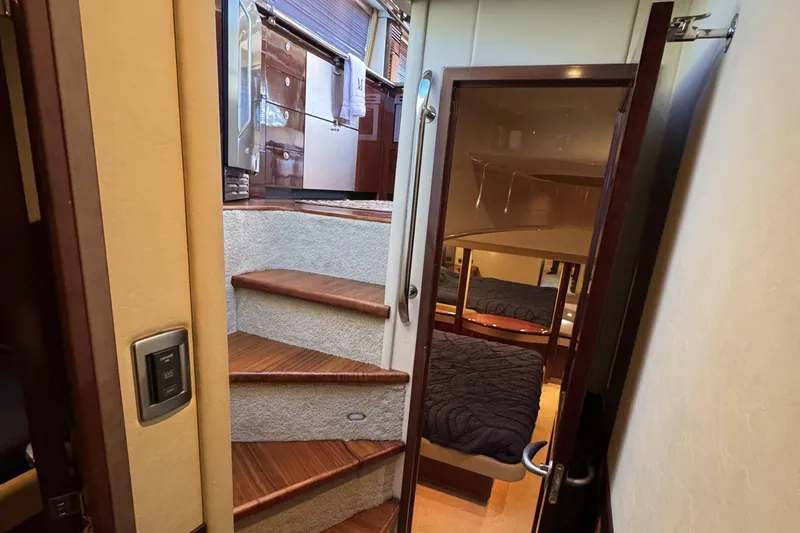 Slide: The Image of Interior view of 2007 Sea Ray 58 Sedan Bridge, featuring stairs and a cozy cabin. - 41
