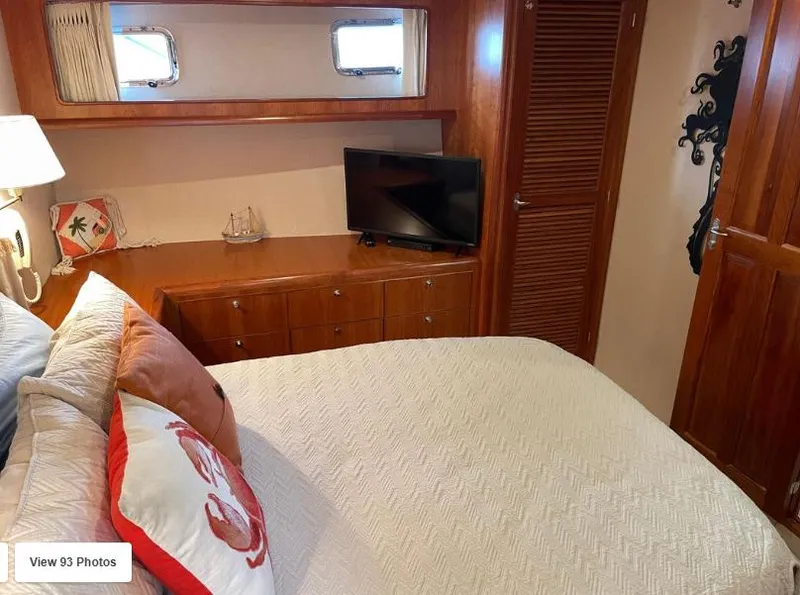Slide: The Image of Luxurious bedroom in 2002 Grand Alaskan Cockpit Motor Yacht with cozy bedding and TV. - 41
