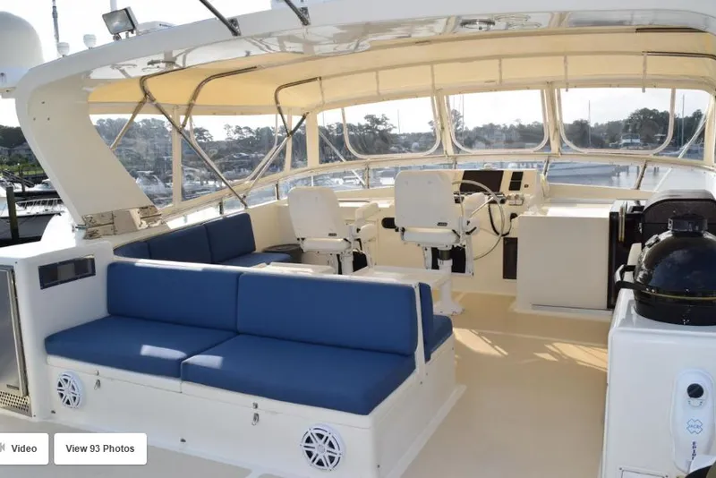 Slide: The Image of 2002 Grand Alaskan Cockpit Motor Yacht interior with blue seating and helm station. - 3