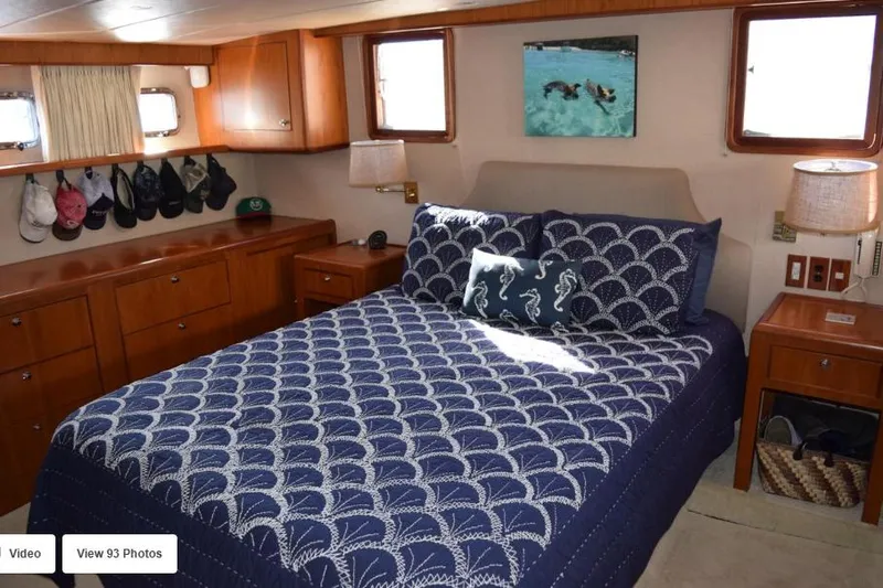 Slide: The Image of Luxurious bedroom in 2002 Grand Alaskan Cockpit Motor Yacht with nautical decor. - 33