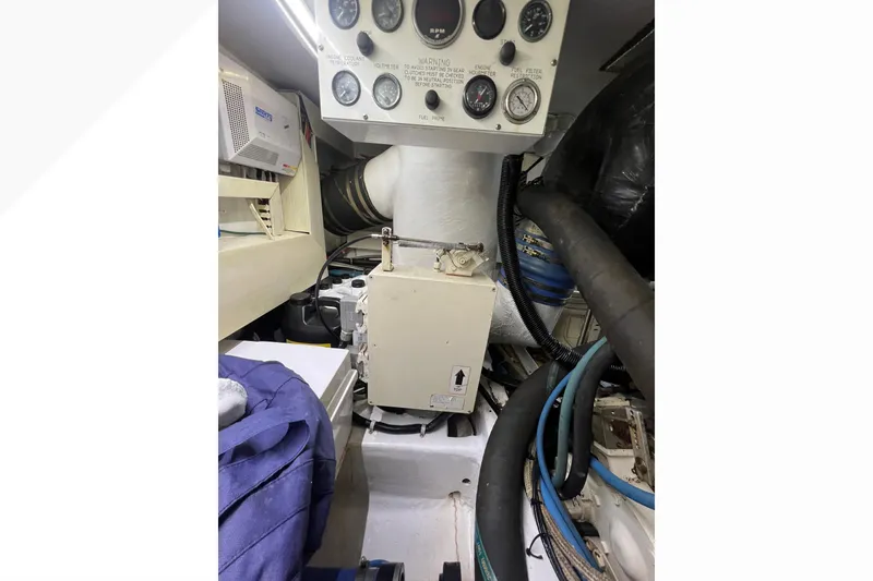 Slide: The Image of Engine room of 1999 Viking 60 CPMY yacht with control panel and equipment. - 117