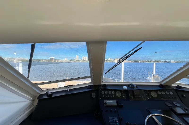 Slide: The Image of Interior view from 1999 Viking 60 CPMY yacht cockpit overlooking waterfront cityscape. - 39