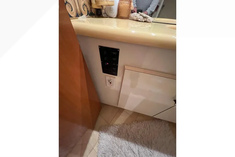 Slide: The Image of 1999 Viking 60 CPMY yacht interior with control panel and countertop. - 107
