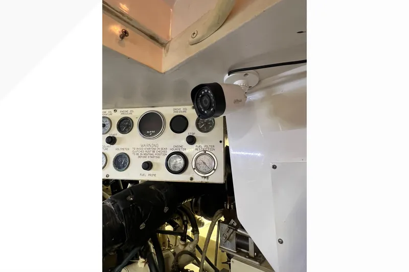 Slide: The Image of 1999 Viking 60 CPMY engine room with control panel and security camera. - 123