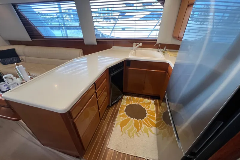 Slide: The Image of Luxurious kitchen interior of 1999 Viking 60 CPMY yacht with modern amenities. - 71