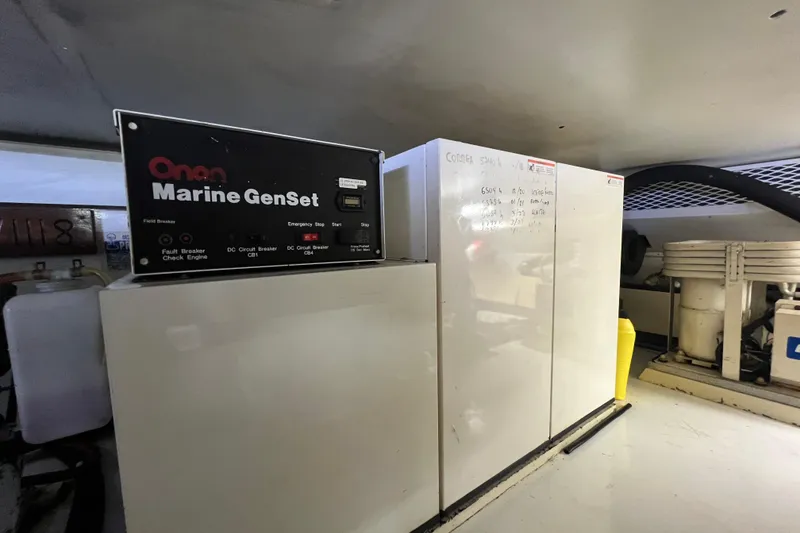 Slide: The Image of Engine room of 1999 Viking 60 CPMY with Onan Marine GenSet generator. - 137