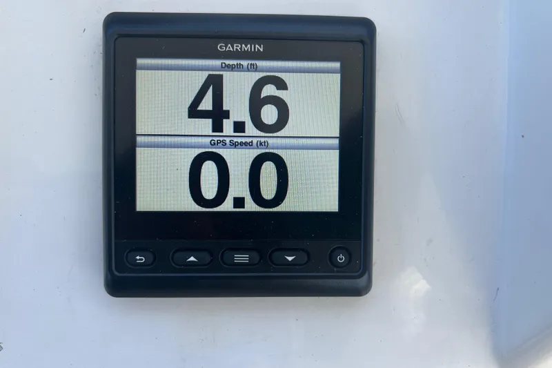 Slide: The Image of Garmin display showing depth 4.6 ft and GPS speed 0.0 knots on 1998 Hyatt yacht. - 49