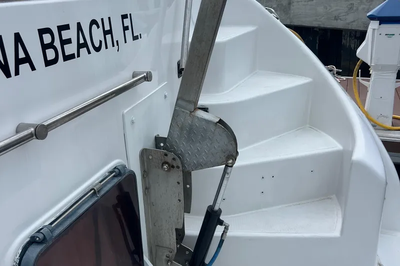 Slide: The Image of 1998 Hyatt 51 Aft Cabin Motor Yacht stairs and railing, docked in Marina Beach, FL. - 10