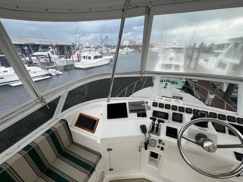 Slide: The Image of Cockpit view of 1998 Hyatt 51 Aft Cabin Motor Yacht in marina setting. - 40
