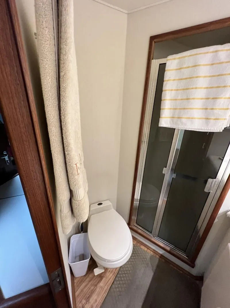 Slide: The Image of Bathroom in 1991 Viking Convertible boat with shower and toilet. - 70