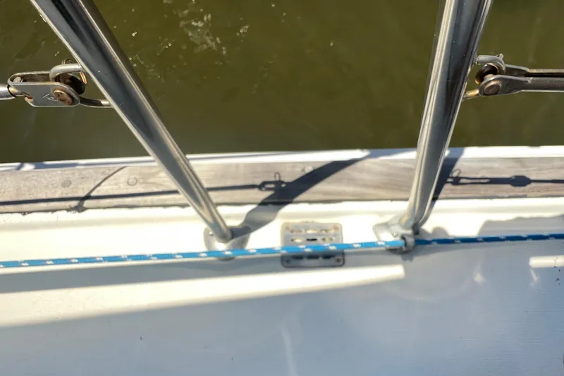 Slide: The Image of Deck view of a 2001 Beneteau Oceanis 473 sailboat with railing and rope details. - 29