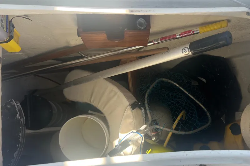 Slide: The Image of Storage compartment of a 2001 Beneteau Oceanis 473 sailboat with various equipment. - 40