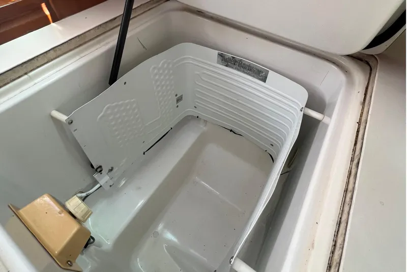 Slide: The Image of Open storage compartment on a 2001 Beneteau Oceanis 473 sailboat. - 74