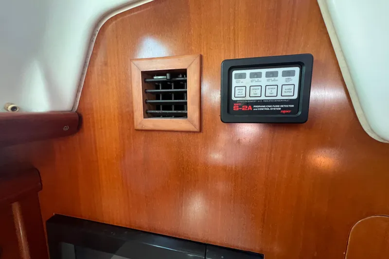 Slide: The Image of Interior of 2001 Beneteau Oceanis 473 with propane fume detector and wooden vent. - 73