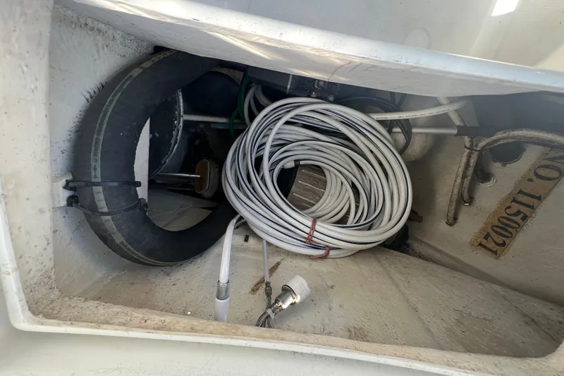 Slide: The Image of Storage compartment of a 2001 Beneteau Oceanis 473 sailboat with coiled cables and equipment. - 41
