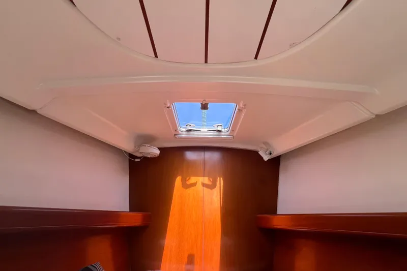 Slide: The Image of Interior cabin view of a 2001 Beneteau Oceanis 473 sailboat with a skylight. - 93