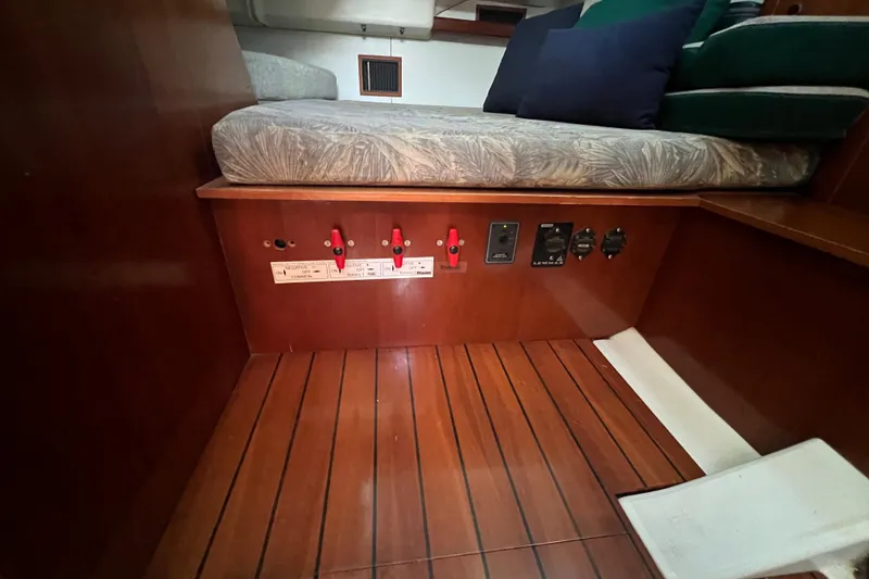 Slide: The Image of Interior of 2001 Beneteau Oceanis 473 yacht showing wooden flooring and control panel. - 83
