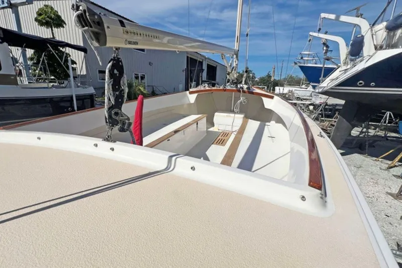 Slide: The Image of 2019 Alerion Express 20 sailboat in a boatyard, showcasing deck and rigging. - 8