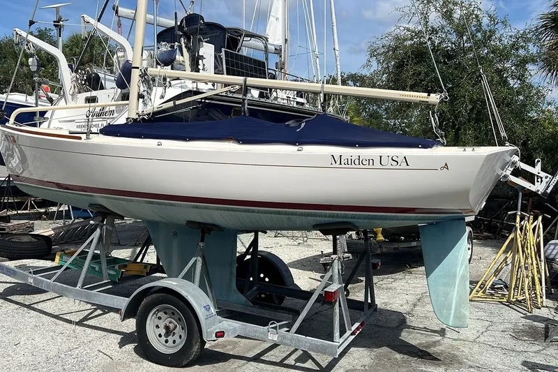 The Image of 2019 Alerion Express 20 sailboat "Maiden USA" on trailer, outdoor setting. - 0