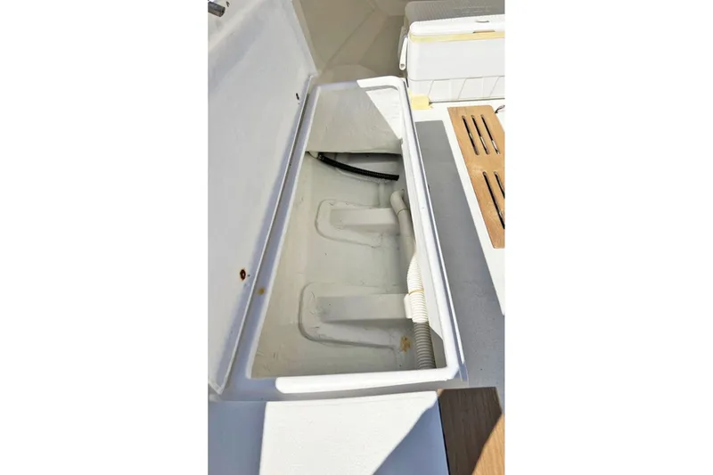 Slide: The Image of Open storage compartment on 2019 Alerion Express 20 sailboat deck. - 12