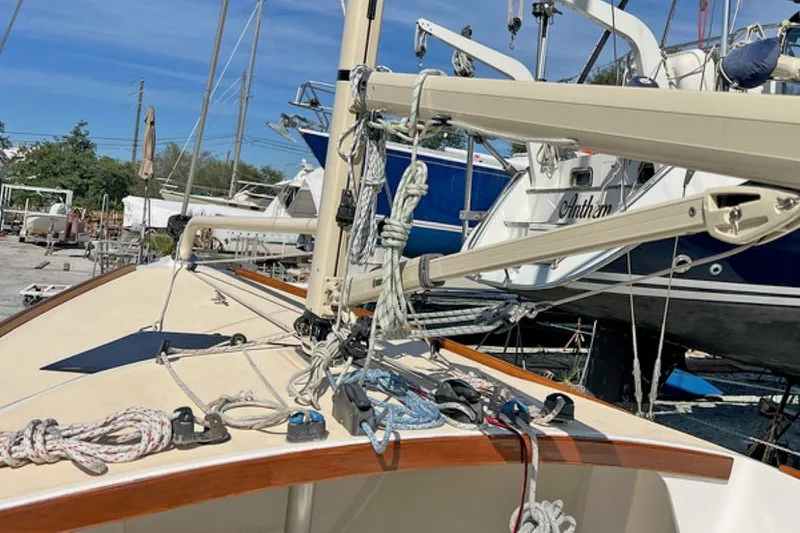 Slide: The Image of 2019 Alerion Express 20 sailboat deck with rigging and ropes in a marina. - 7