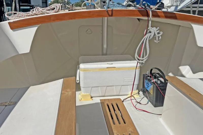 Slide: The Image of 2019 Alerion Express 20 cockpit with cooler, ropes, and battery setup. - 10