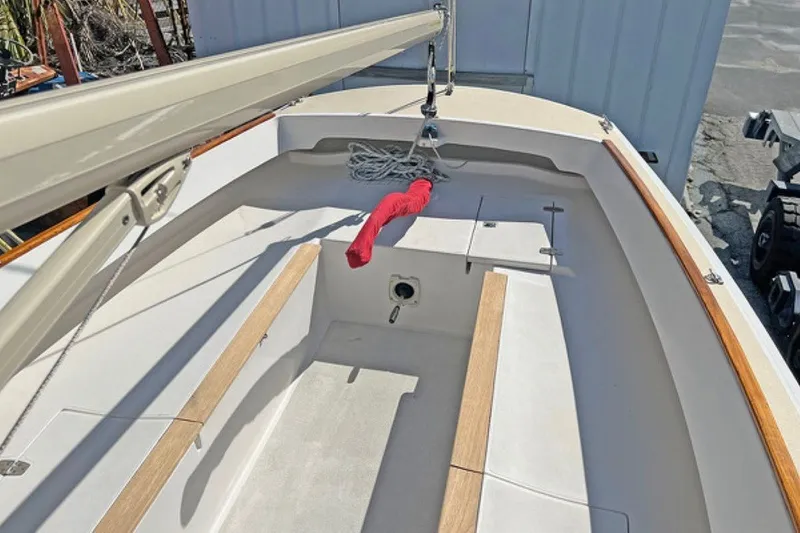 Slide: The Image of 2019 Alerion Express 20 sailboat interior with wooden trim and rigging. - 6