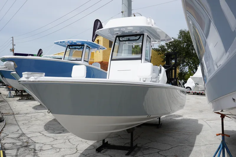 The Image of 2027 Sportsman Masters 247 Bay Boat displayed outdoors on a sunny day. - 0