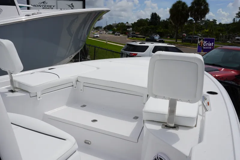Slide: The Image of 2027 Sportsman Masters 247 Bay Boat with white seating and spacious deck. - 18