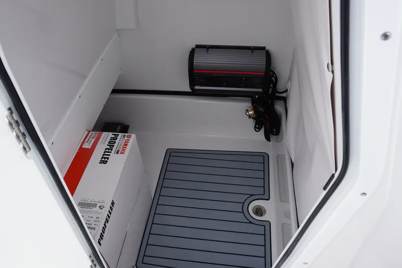 Slide: The Image of Storage compartment of 2027 Sportsman Masters 247 Bay Boat with Yamaha propeller box. - 22