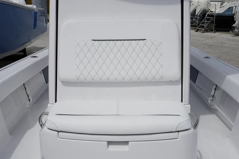 Slide: The Image of White seating on 2027 Sportsman Masters 247 Bay Boat, featuring diamond-pattern upholstery. - 19