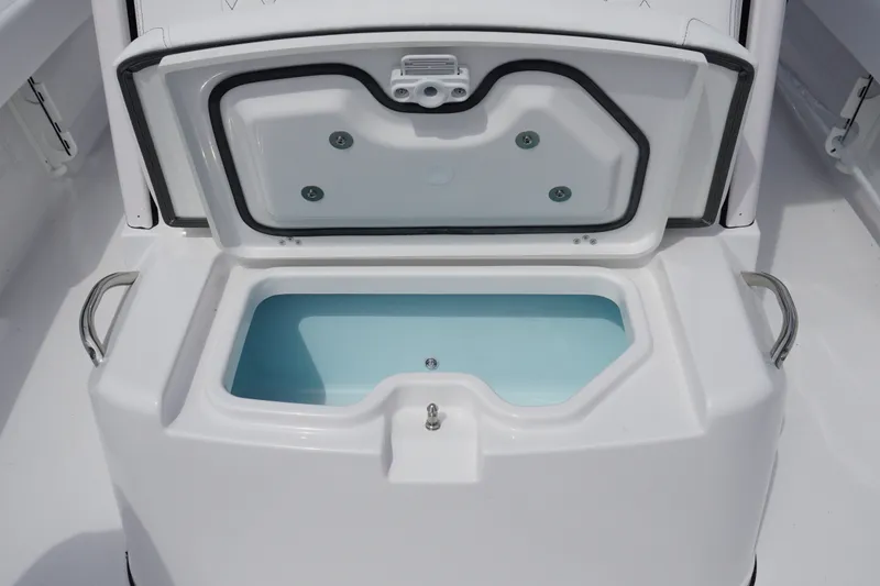 Slide: The Image of Open storage compartment on 2027 Sportsman Masters 247 Bay Boat, featuring sleek design and handles. - 20