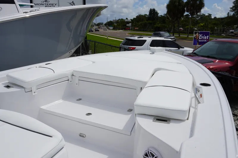 Slide: The Image of 2027 Sportsman Masters 247 Bay Boat with white seating and spacious deck. - 17