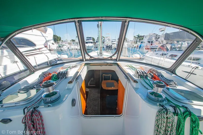 Slide: The Image of 2005 Beneteau Oceanis 423 yacht cockpit with vibrant ropes and marina view. - 8